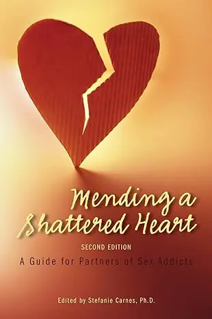 Book cover of 'Mending a Shattered Heart' with a torn heart image.