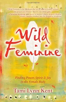 Book cover with the title 'Wild & Feminine' and a feather illustration.