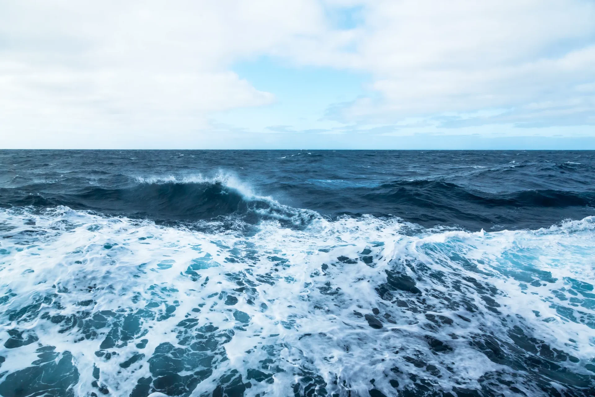 Blue ocean with white-capped waves