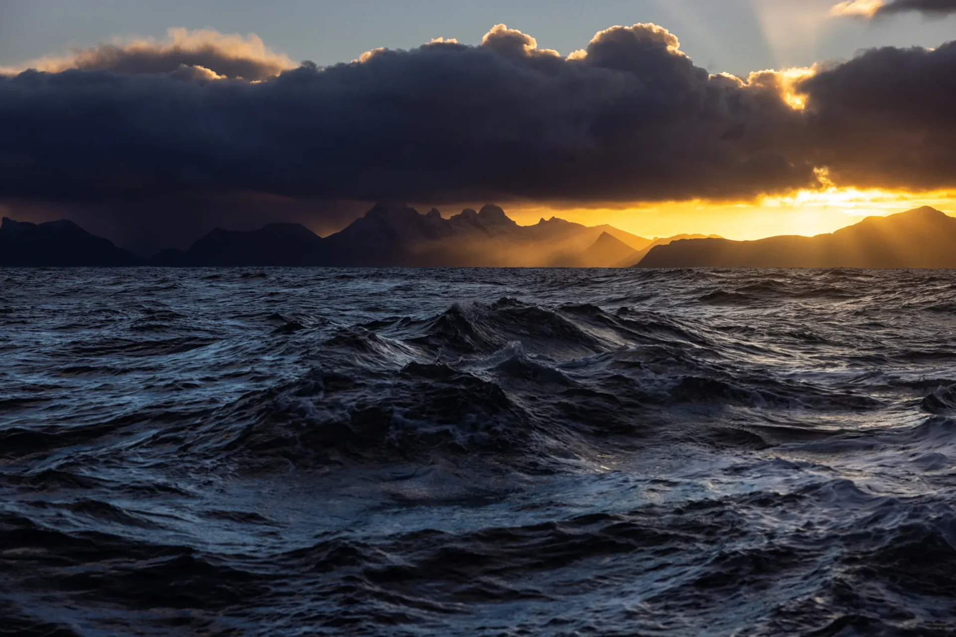 Dramatic ocean waves at sunset