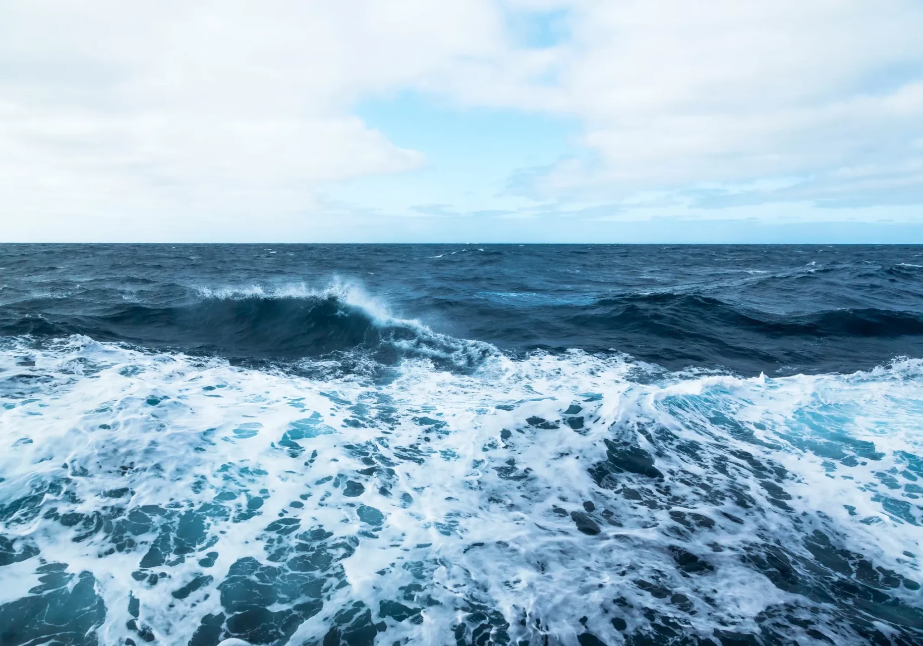 Blue ocean with white-capped waves